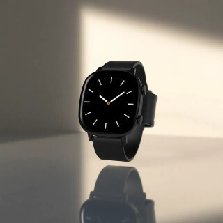 Matte-black smart-watch floating in soft spotlight, dramatic shadows, reflections on glossy surface